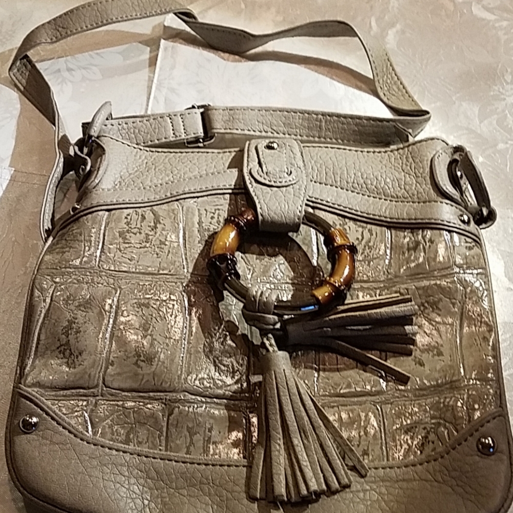 M.C. gray leather handbag